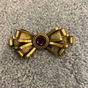 Brass brooch with faux amethyst